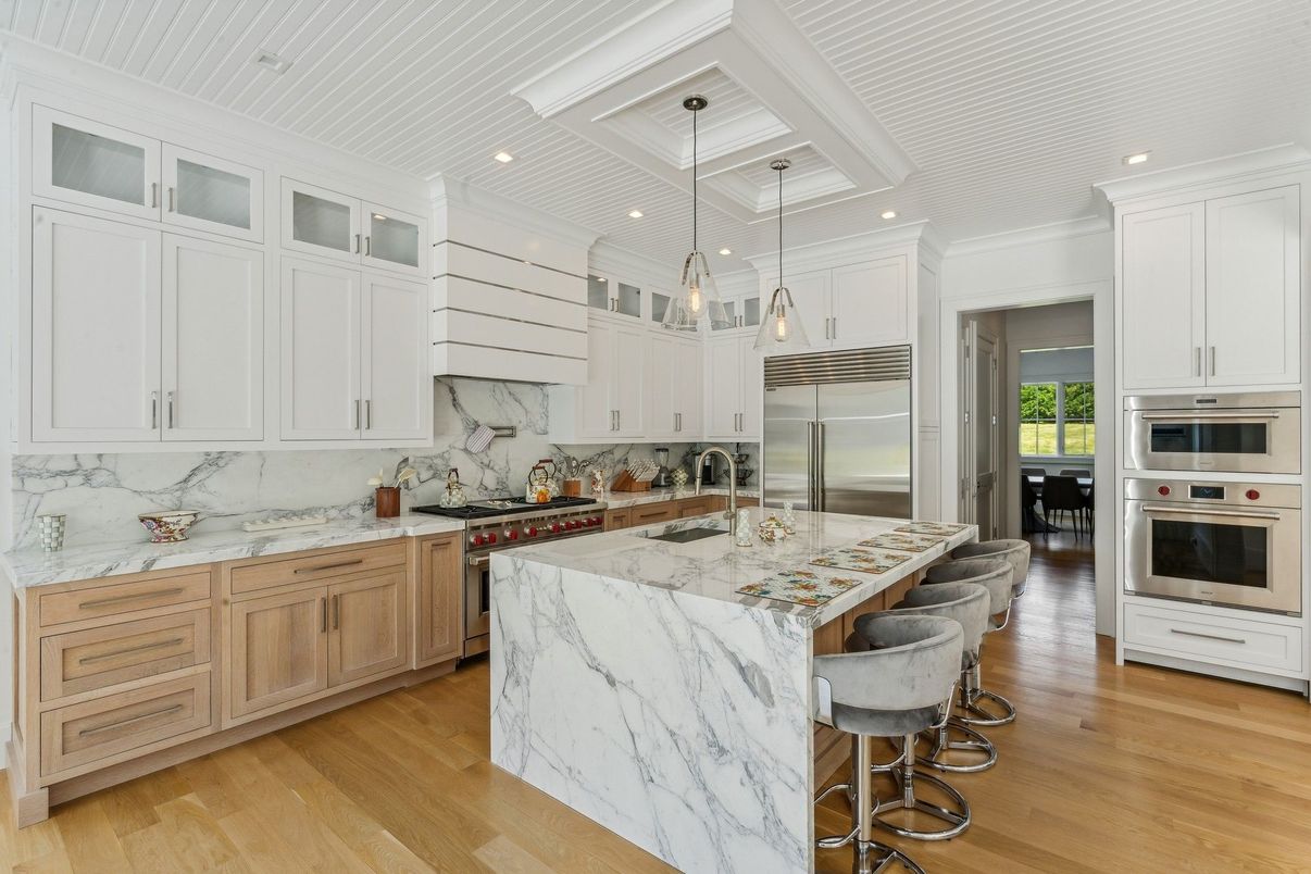 Interior, Kitchen, Marble Walls, Pendant Lights, Recessed Lighting, Stainless Steel Appliances, Wood Texture Flooring
