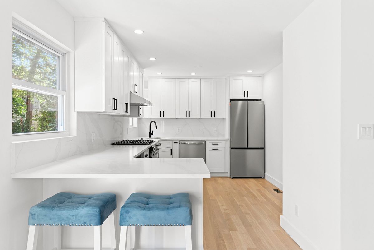 Interior, Kitchen, Marble Walls, Recessed Lighting, Stainless Steel Appliances, Wood Texture Flooring