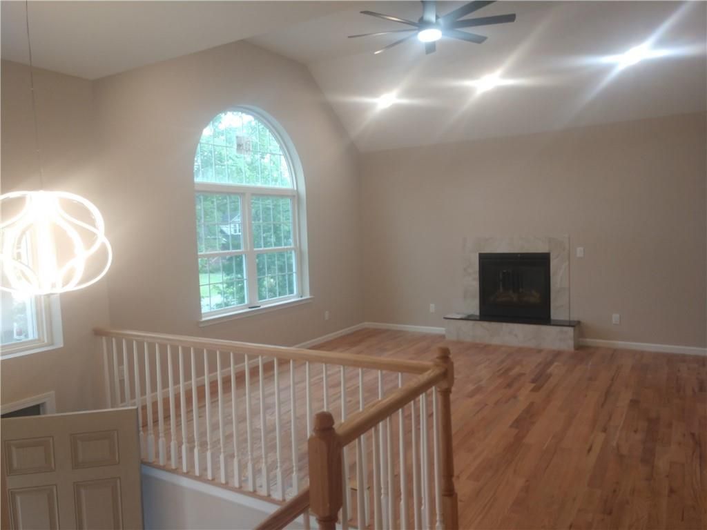 Empty room, Fireplace, Interior, Pendant Lights, Recessed Lighting, Wood Texture Flooring