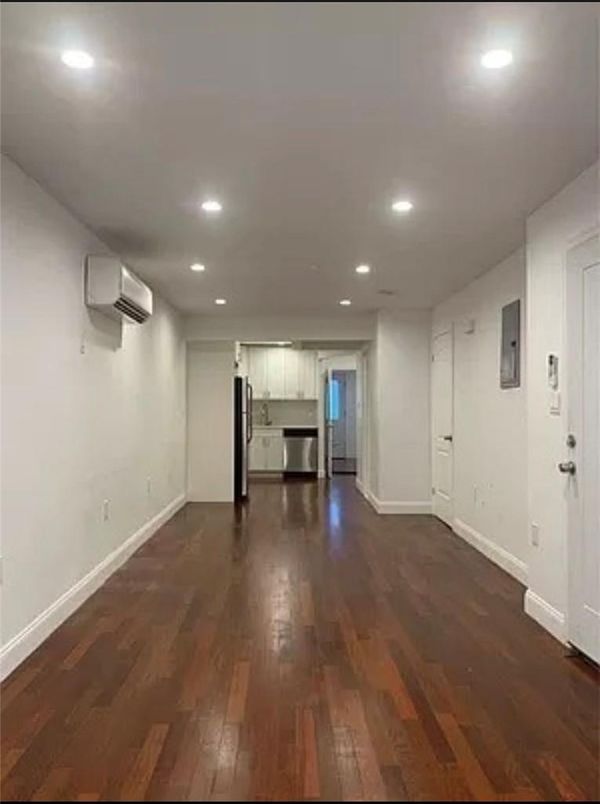 Empty room, Interior, Kitchen, Recessed Lighting, Stainless Steel Appliances, Wood Texture Flooring
