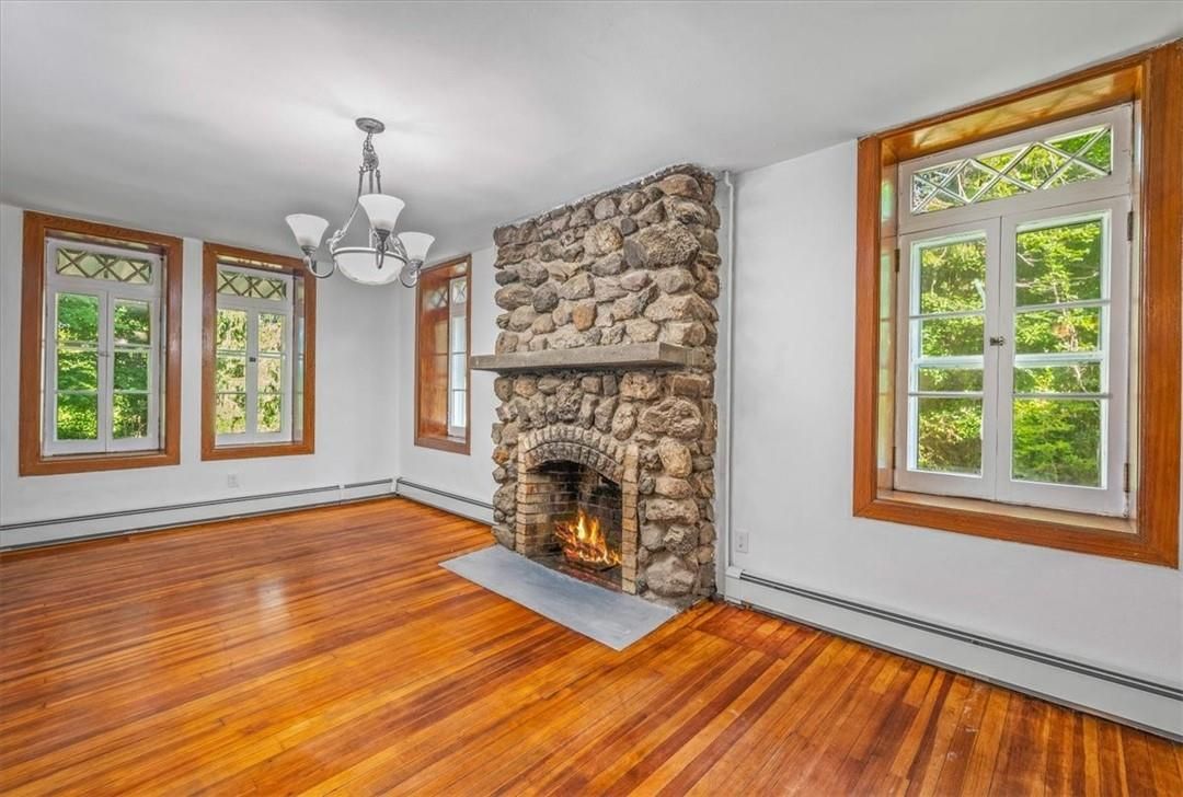 Chandelier, Empty room, Fireplace, Interior, Stone Walls, Wood Texture Flooring