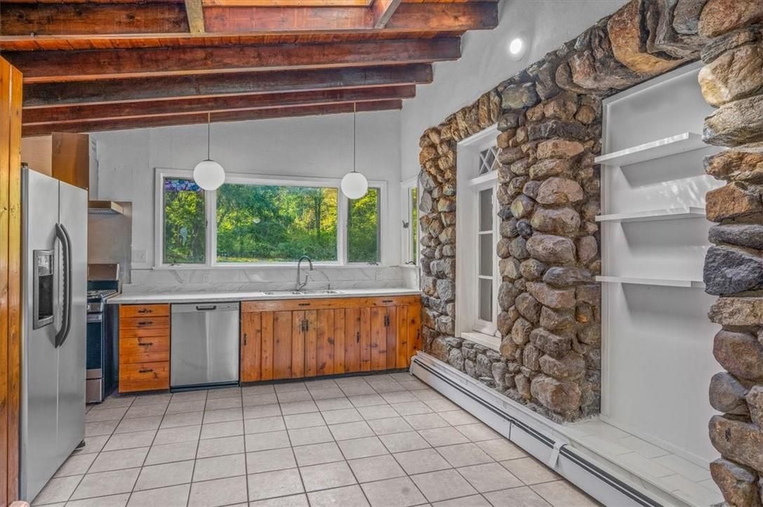 Interior, Kitchen, Pendant Lights, Recessed Lighting, Stainless Steel Appliances, Stone Walls, Wooden Beams