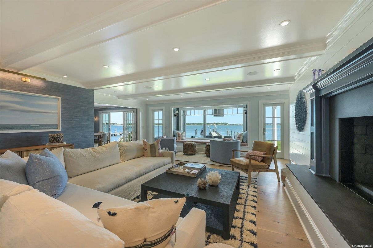 Dining room, Fireplace, Interior, Living room, Recessed Lighting, Water, Wood Texture Flooring