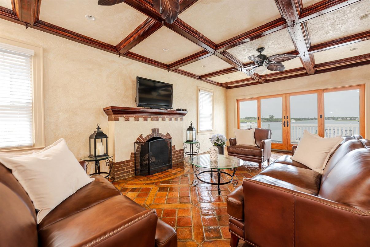 Fireplace, Interior, Living room, Recessed Lighting, Water, Wooden Beams