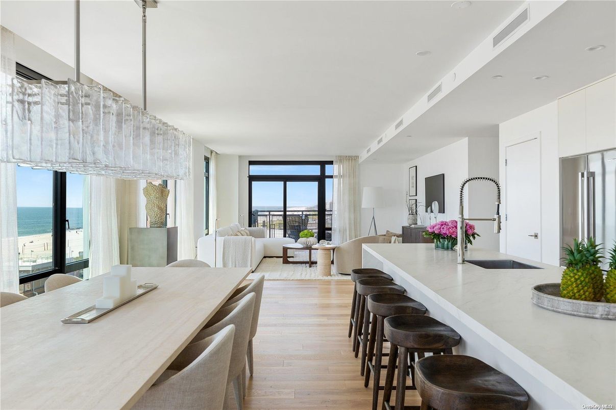 Dining room, Interior, Kitchen, Living room, Recessed Lighting, Stainless Steel Appliances, Water, Wood Texture Flooring