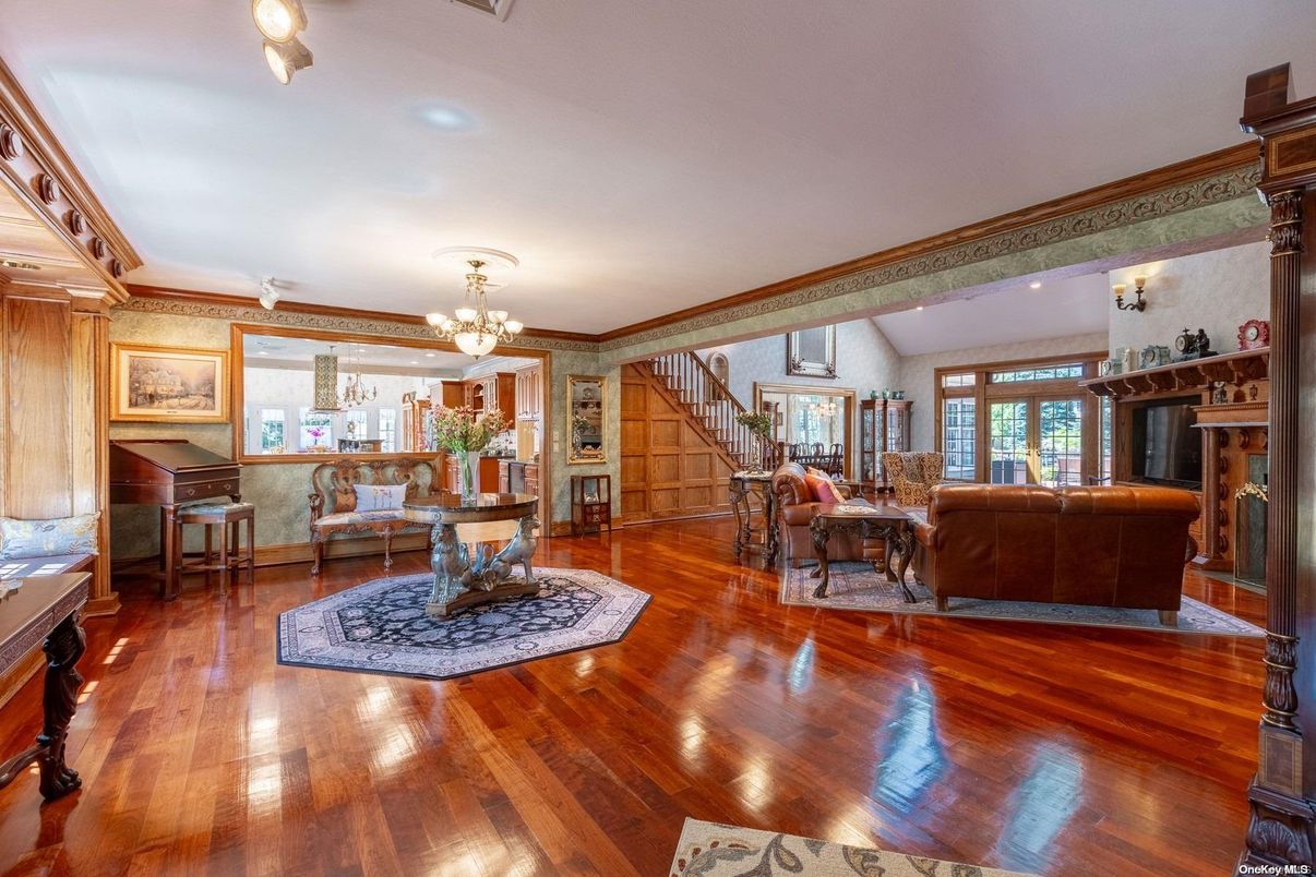 Chandelier, Dining room, Fireplace, Interior, Living room, Piano, Recessed Lighting, Wood Texture Flooring