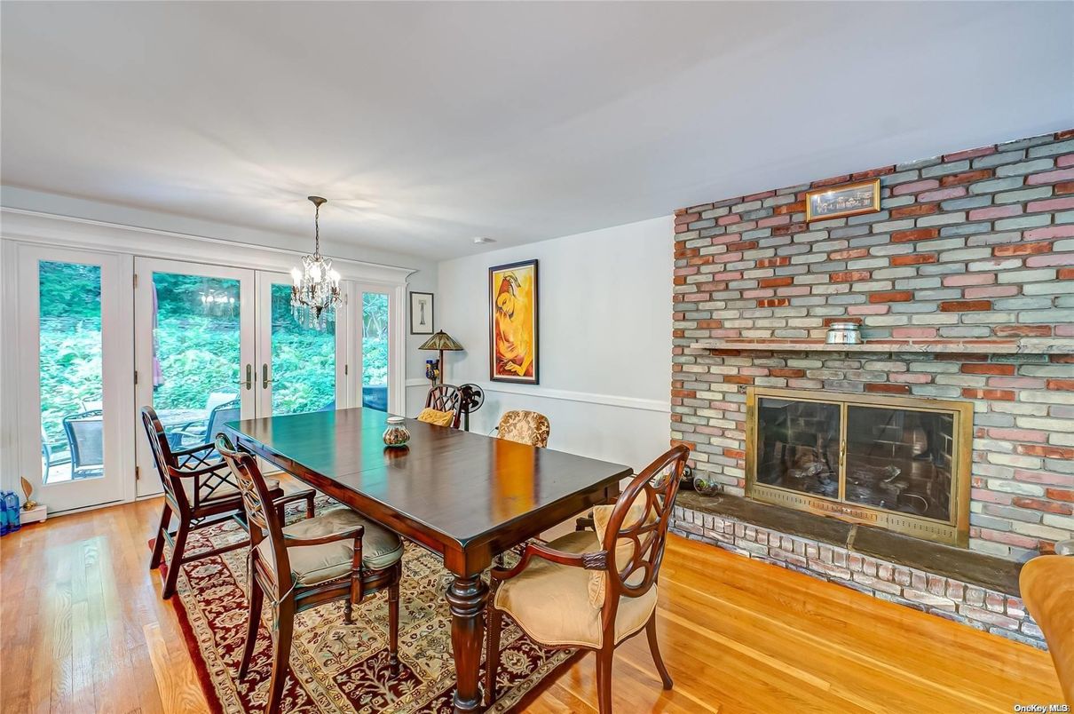 Chandelier, Dining room, Fireplace, Interior, Stone Walls, Wood Texture Flooring