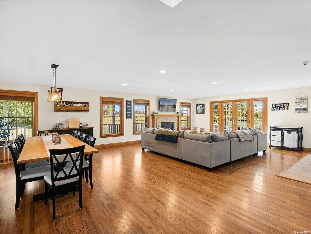 Dining room, Fireplace, Interior, Living room, Pendant Lights, Recessed Lighting, Wood Texture Flooring