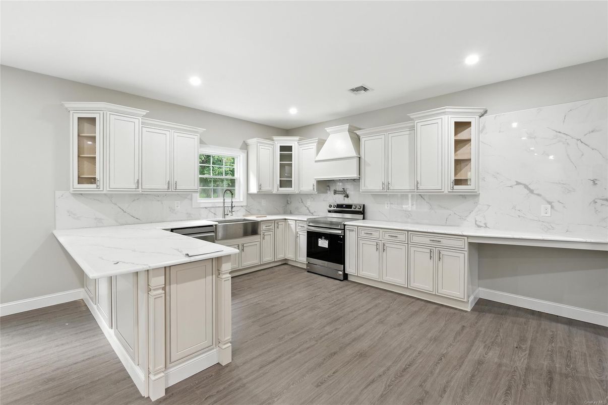 Interior, Kitchen, Marble Walls, Recessed Lighting, Stainless Steel Appliances, Wood Texture Flooring