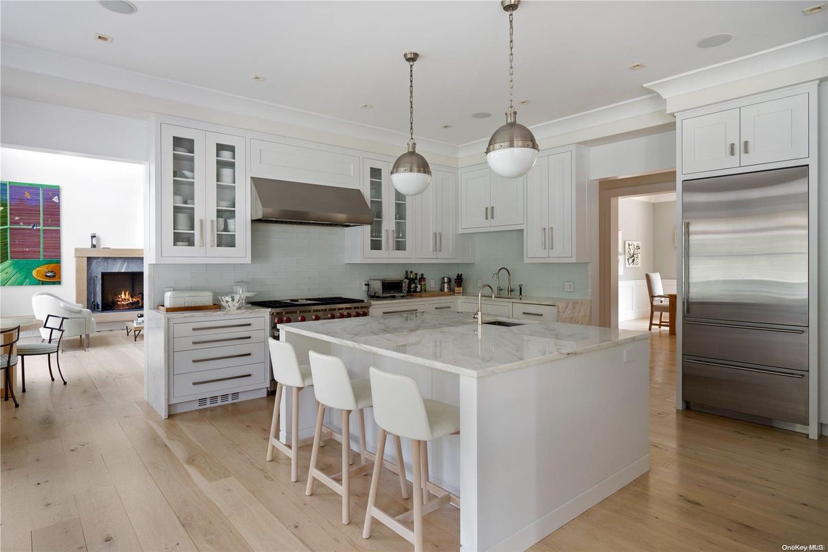 Fireplace, Interior, Kitchen, Living room, Pendant Lights, Recessed Lighting, Stainless Steel Appliances, Wood Texture Flooring