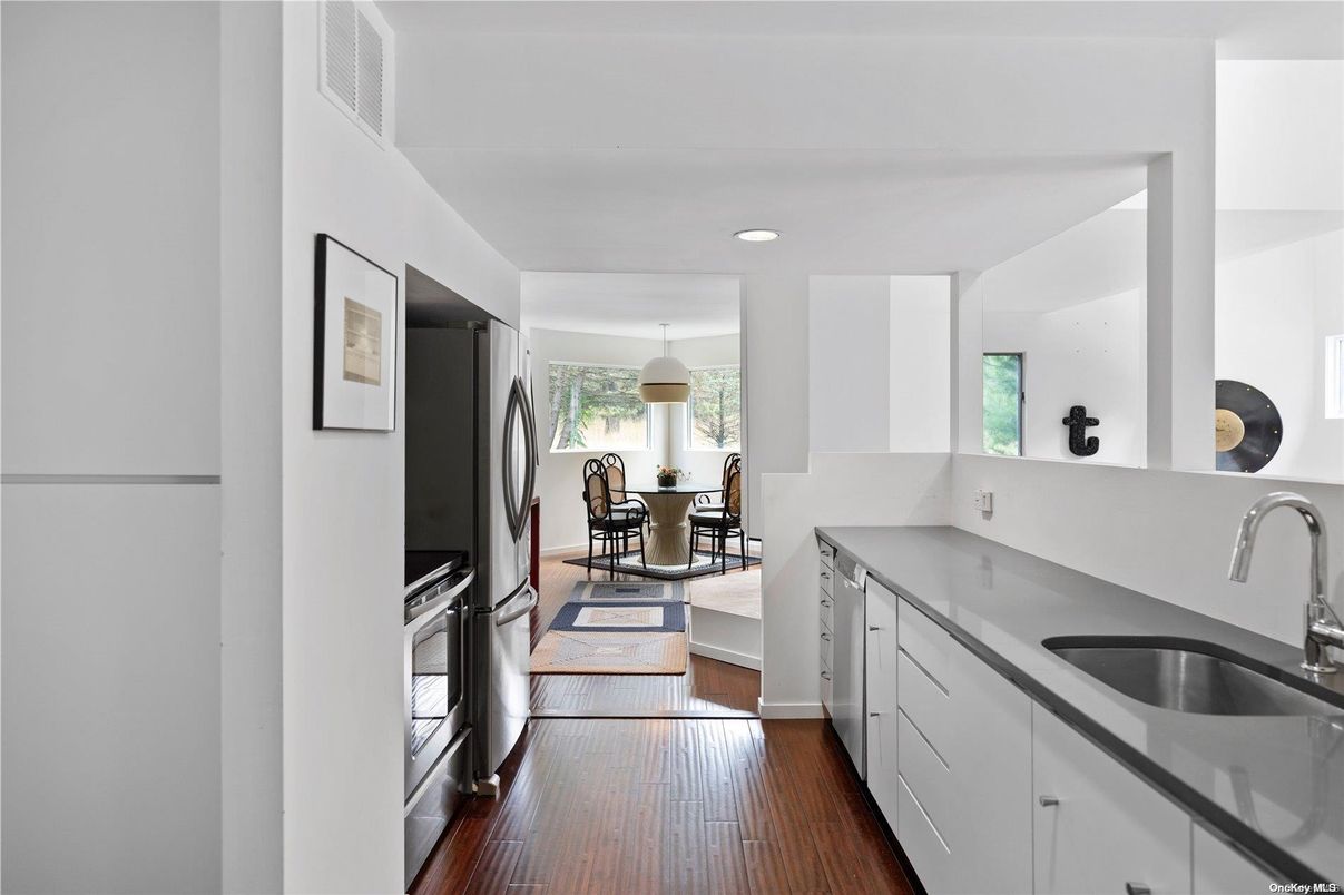 Dining room, Interior, Kitchen, Pendant Lights, Recessed Lighting, Stainless Steel Appliances, Wood Texture Flooring