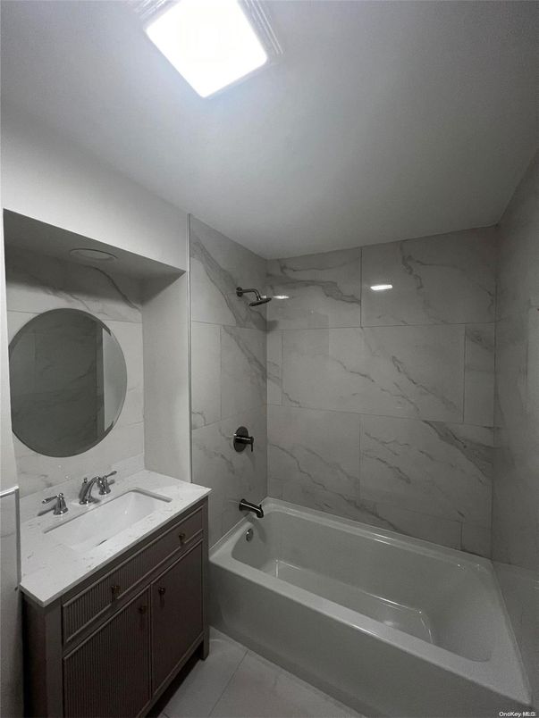 Bathroom, Dual Sink Vanities, Interior, Marble Walls, Recessed Lighting