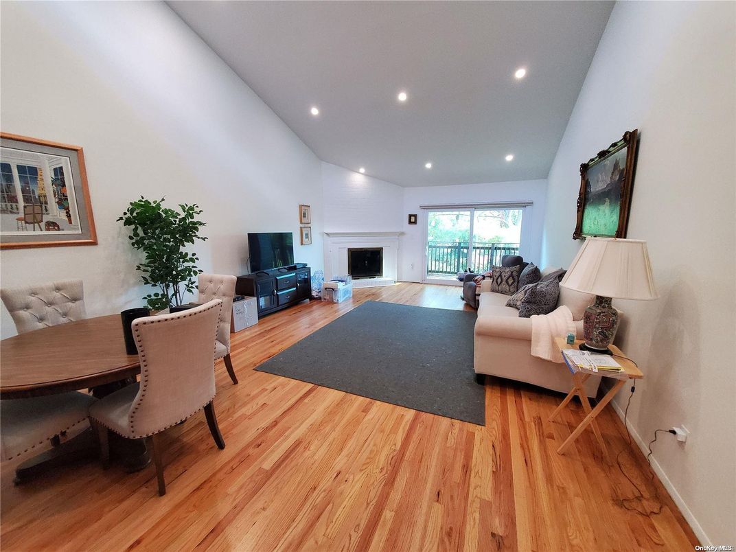 Dining room, Fireplace, Interior, Living room, Recessed Lighting, Wood Texture Flooring