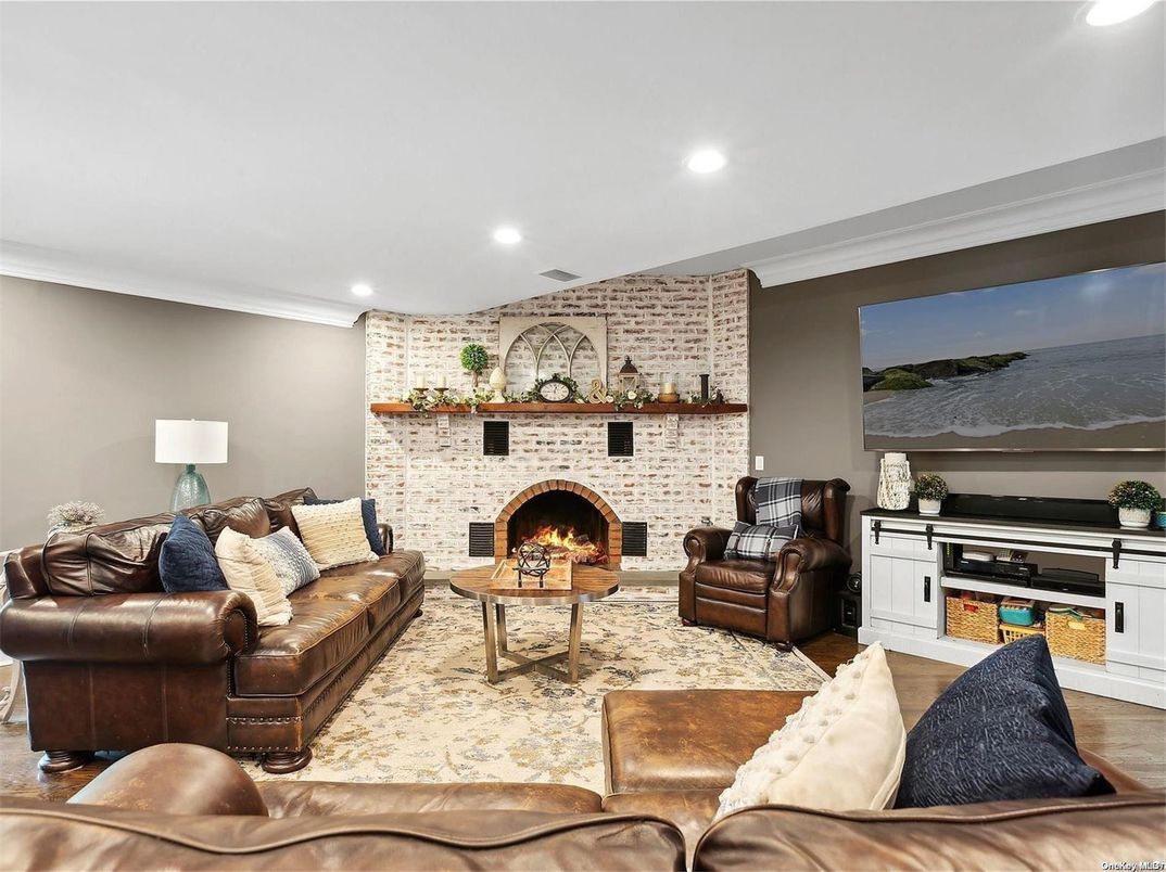 Fireplace, Interior, Living room, Recessed Lighting, Stone Walls, Wood Texture Flooring