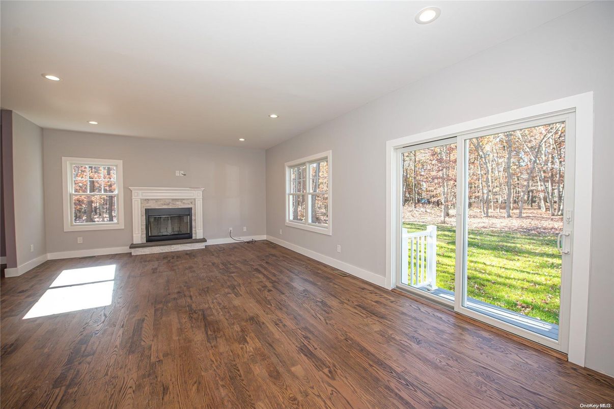 Empty room, Fireplace, Interior, Recessed Lighting, Wood Texture Flooring