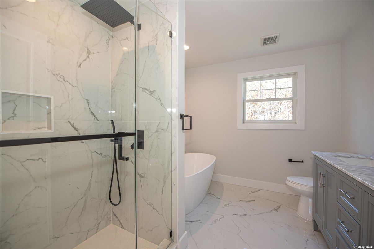 Bathroom, Free Standing Baths, Glass Shower, Interior, Marble, Marble Walls, Recessed Lighting