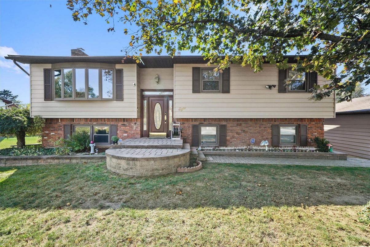Backyard, Exterior, Facade, Brick Facade, Raised Ranch