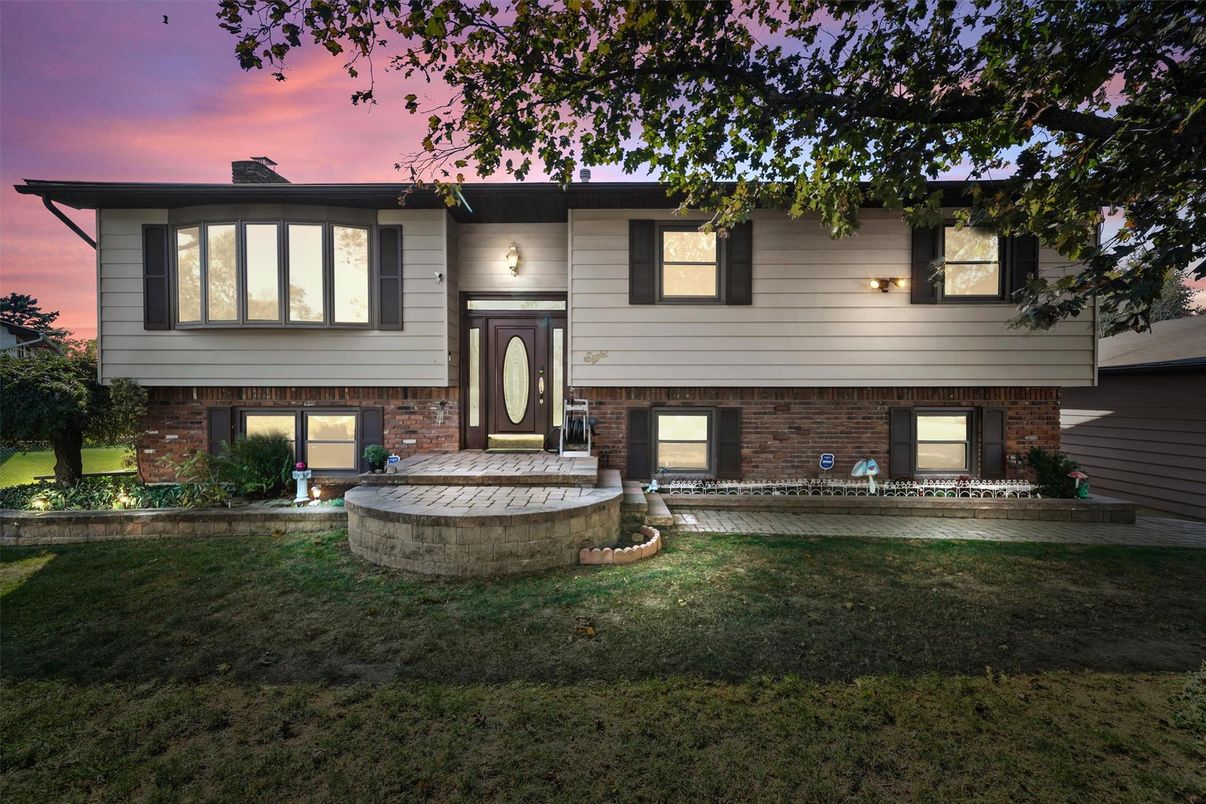 Backyard, Exterior, Facade, Brick Facade, Raised Ranch