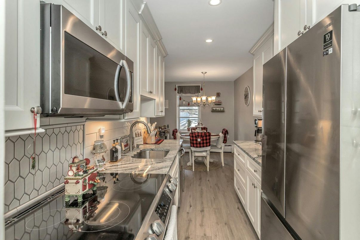 Chandelier, Dining room, Interior, Kitchen, Recessed Lighting, Stainless Steel Appliances, Wood Texture Flooring
