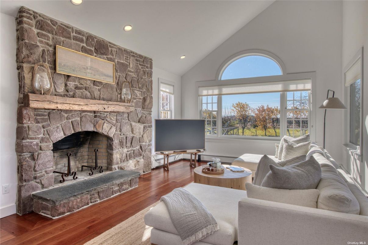 Fireplace, Interior, Living room, Recessed Lighting, Stone Walls, Wood Texture Flooring