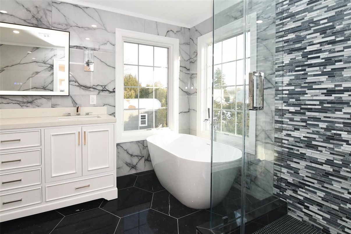 Bathroom, Free Standing Baths, Glass Shower, Interior, Marble, Marble Walls, Recessed Lighting