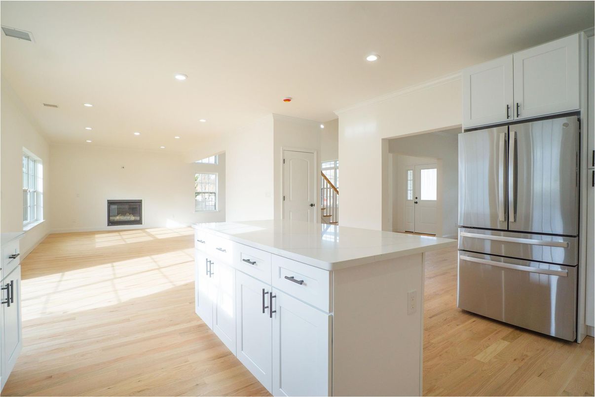 Fireplace, Interior, Kitchen, Recessed Lighting, Stainless Steel Appliances, Wood Texture Flooring