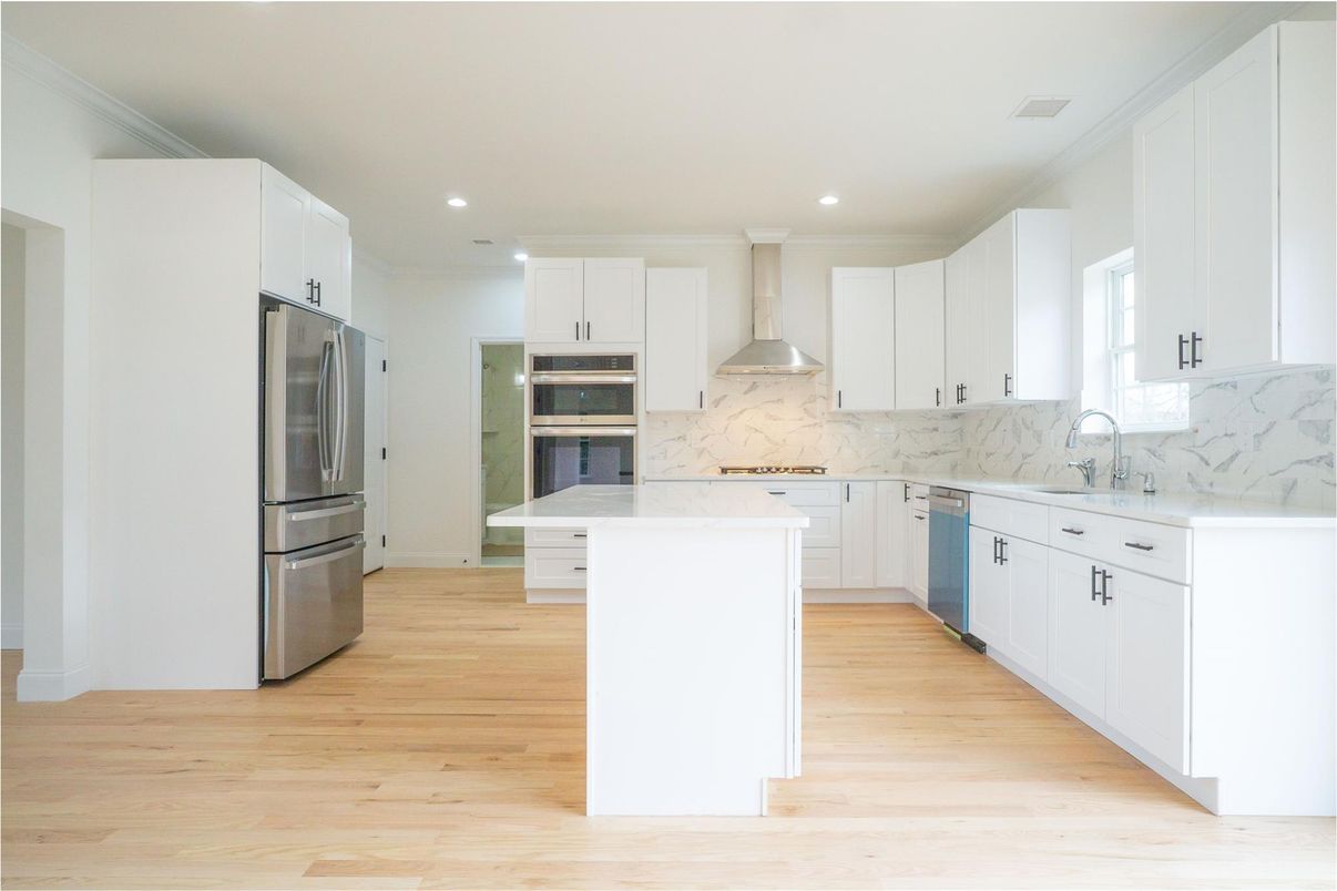 Interior, Kitchen, Marble Walls, Recessed Lighting, Stainless Steel Appliances, Wood Texture Flooring