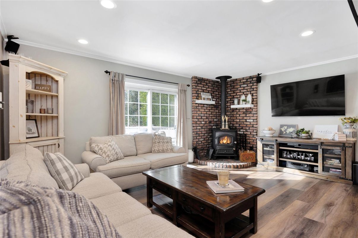 Fireplace, Interior, Living room, Recessed Lighting, Stone Walls, Wood Texture Flooring