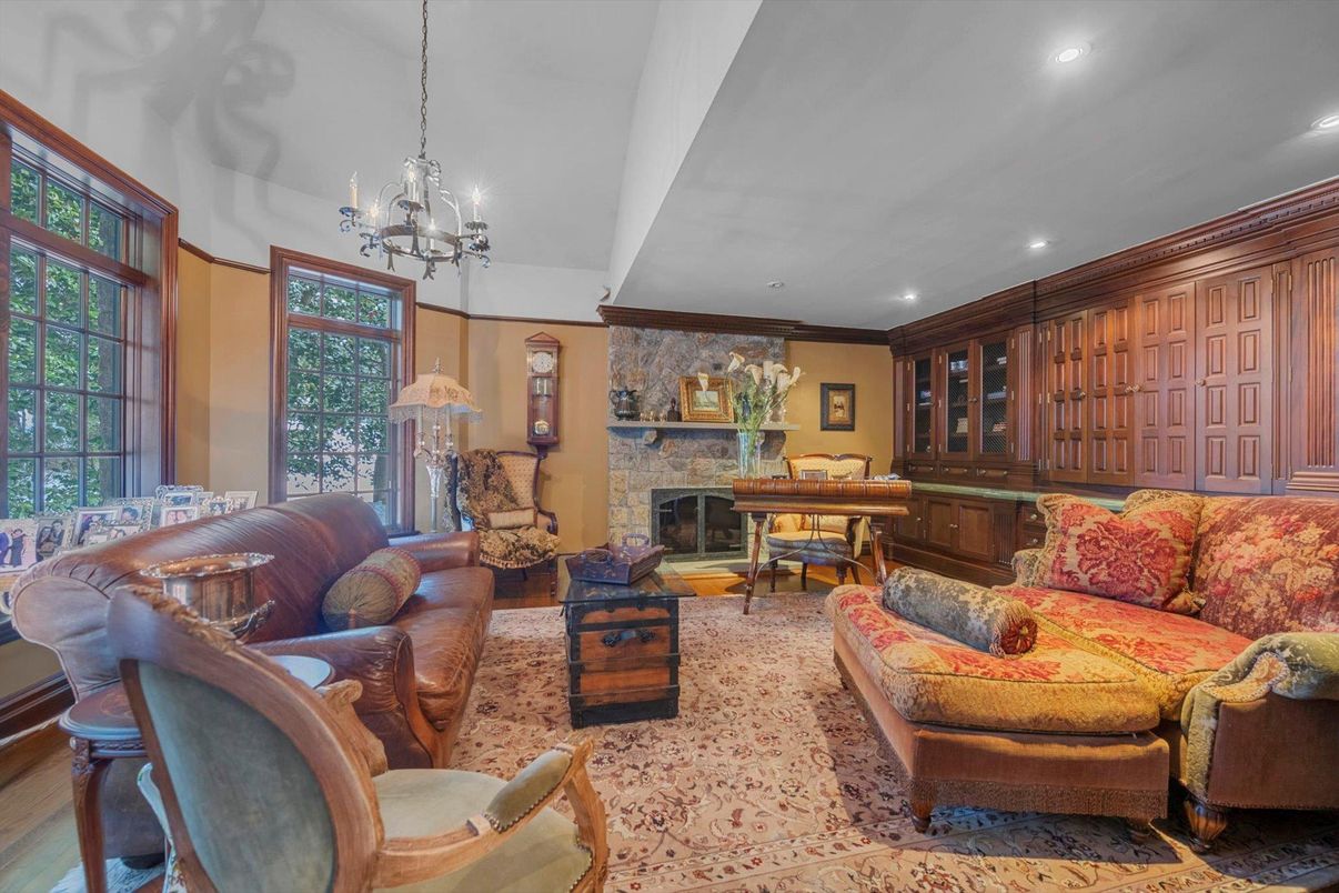 Chandelier, Fireplace, Interior, Living room, Pendant Lights, Piano, Recessed Lighting, Stone Walls