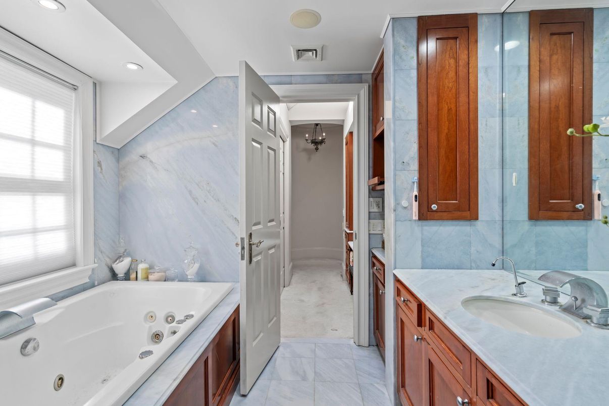 Bathroom, Chandelier, Dual Sink Vanities, Interior, Marble, Marble Walls, Recessed Lighting
