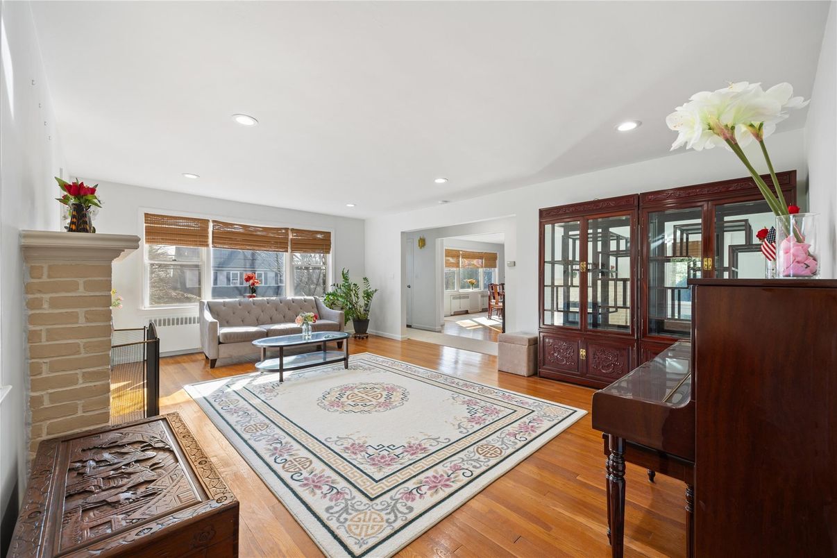 Fireplace, Interior, Living room, Piano, Recessed Lighting, Wood Texture Flooring