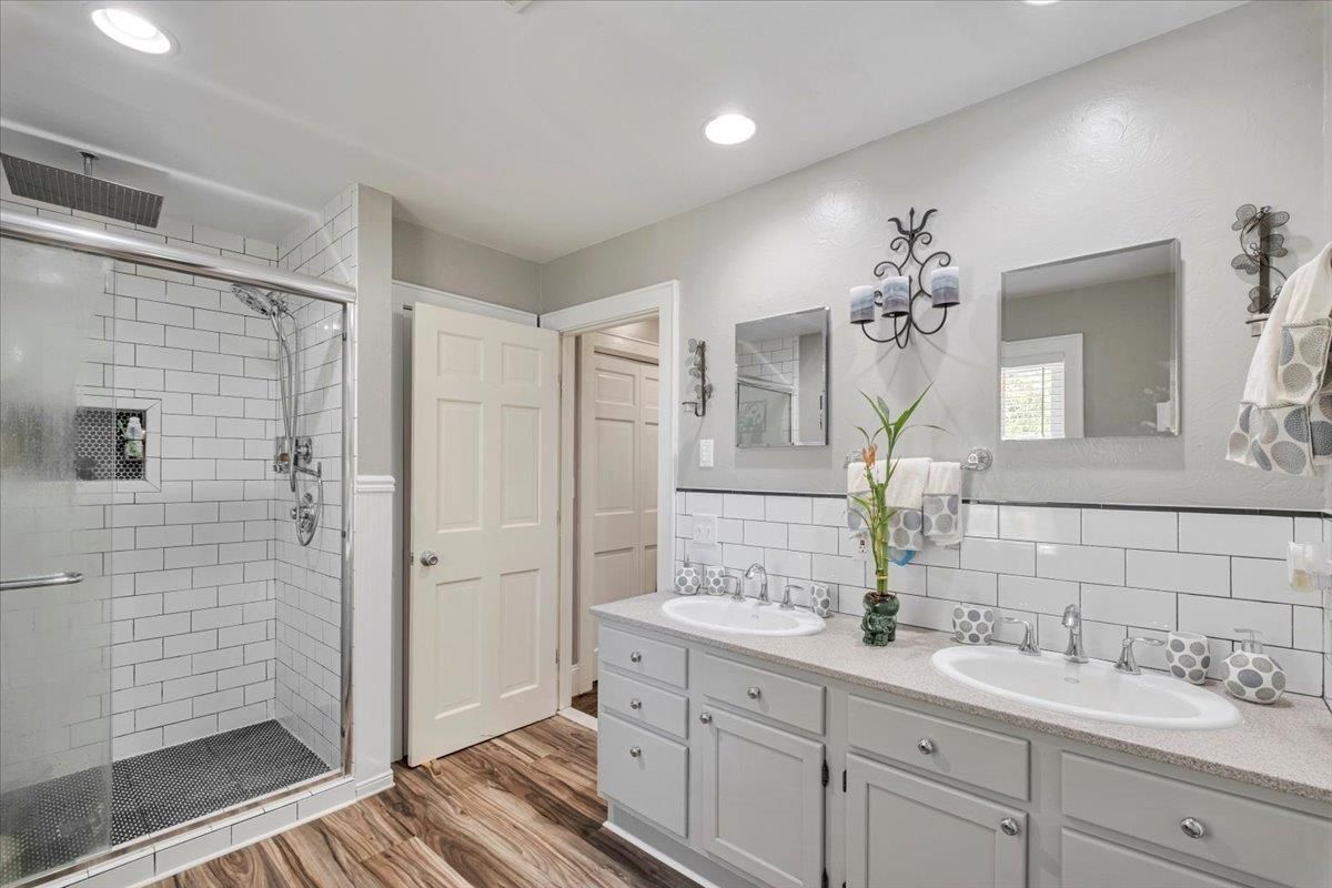 Bathroom, Dual Sink Vanities, Glass Shower, Interior, Recessed Lighting, Wood Texture Flooring
