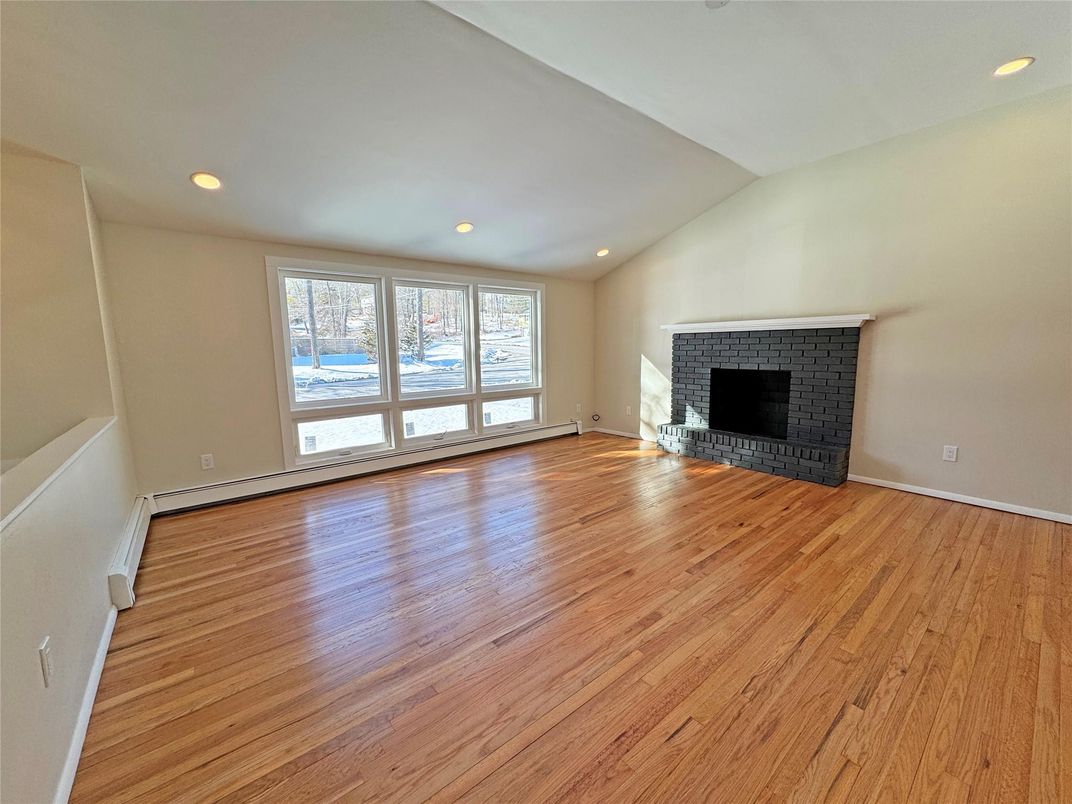 Empty room, Fireplace, Interior, Recessed Lighting, Wood Texture Flooring