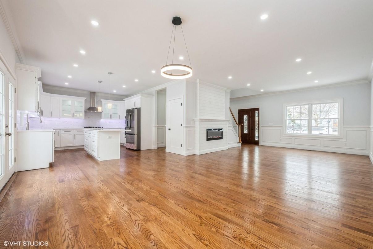 Empty room, Interior, Kitchen, Pendant Lights, Recessed Lighting, Stainless Steel Appliances, Wood Texture Flooring