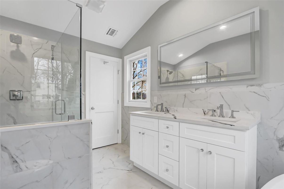 Bathroom, Dual Sink Vanities, Glass Shower, Interior, Marble, Marble Walls, Recessed Lighting