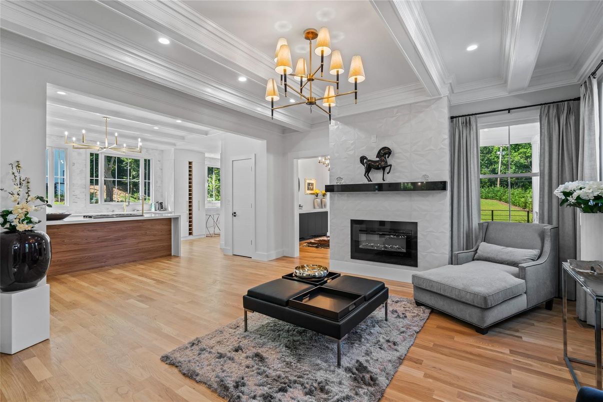 Chandelier, Fireplace, Interior, Living room, Pendant Lights, Recessed Lighting, Wood Texture Flooring