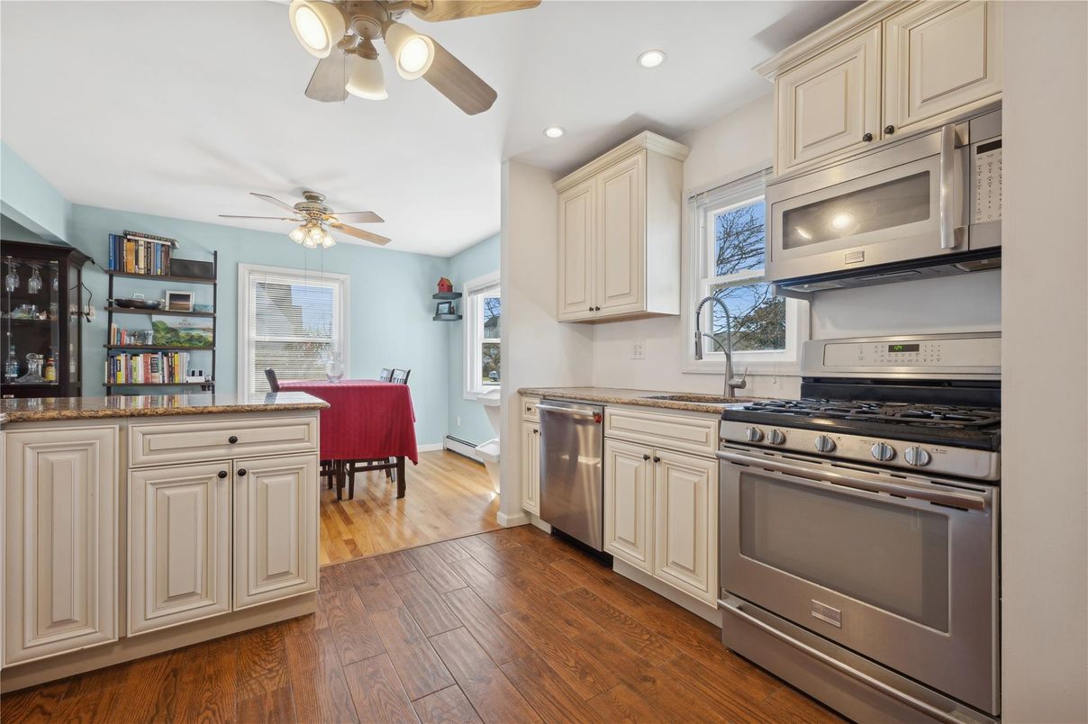 Dining room, Interior, Kitchen, Recessed Lighting, Stainless Steel Appliances, Wood Texture Flooring