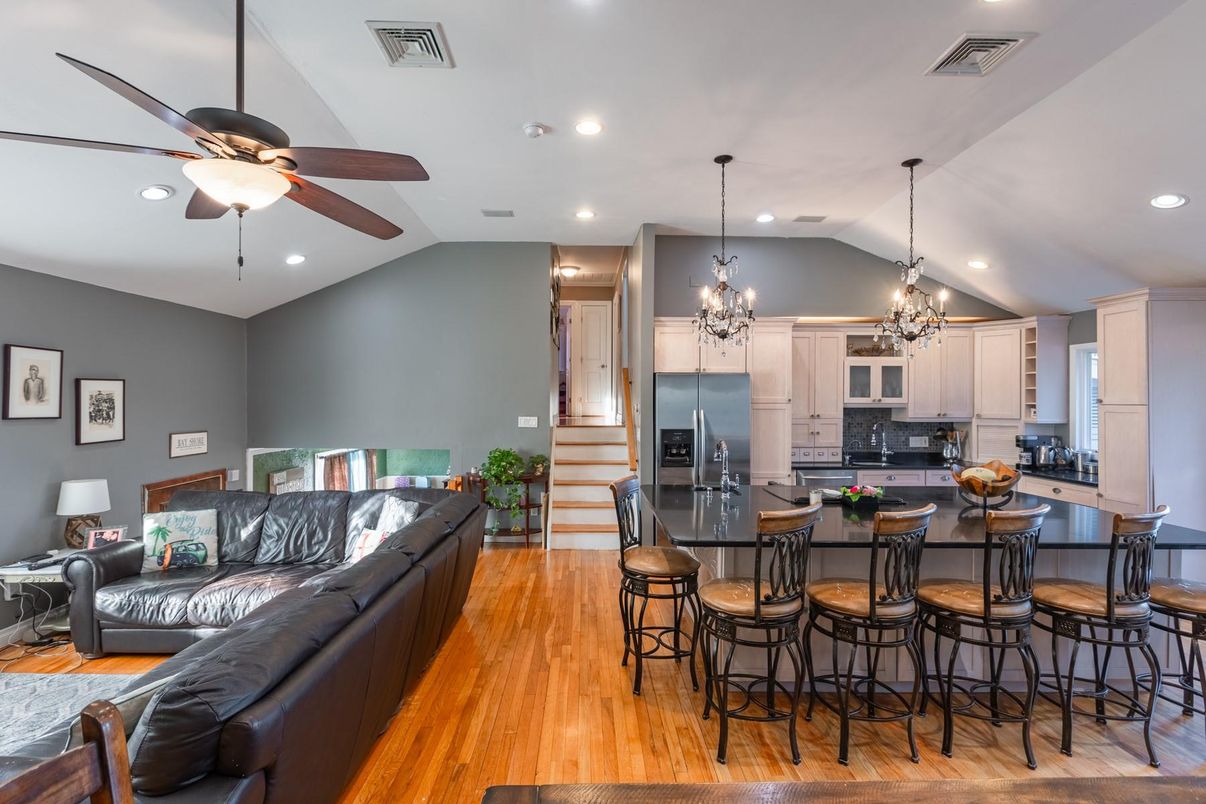 Chandelier, Interior, Kitchen, Living room, Pendant Lights, Recessed Lighting, Stainless Steel Appliances, Wood Texture Flooring