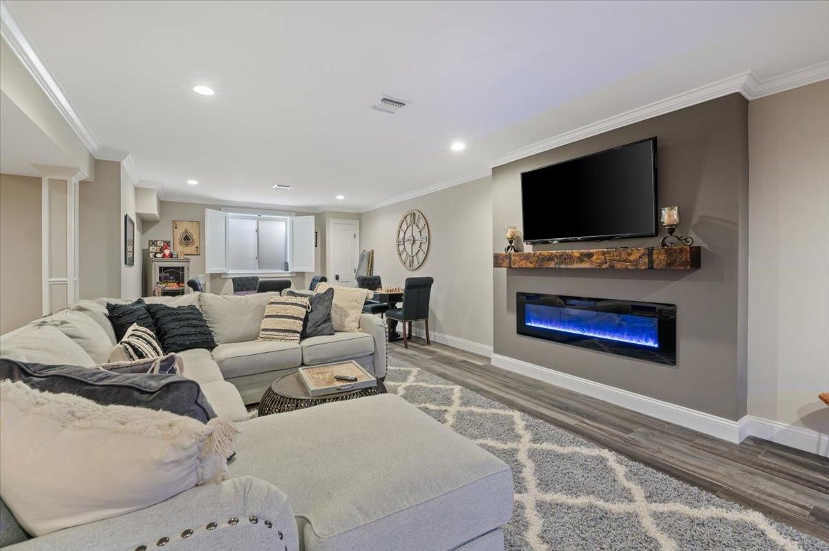 Dining room, Fireplace, Interior, Living room, Recessed Lighting, Wood Texture Flooring