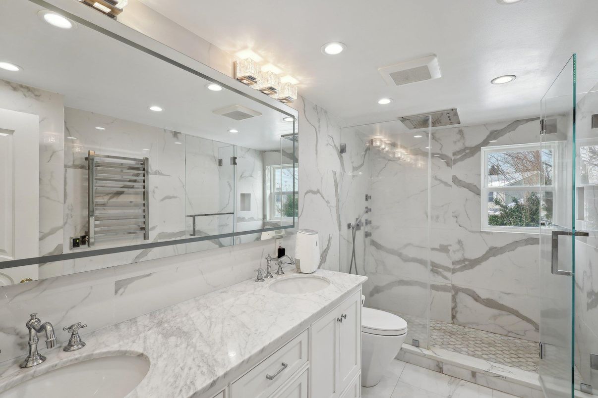 Bathroom, Dual Sink Vanities, Glass Shower, Interior, Marble, Marble Walls, Recessed Lighting