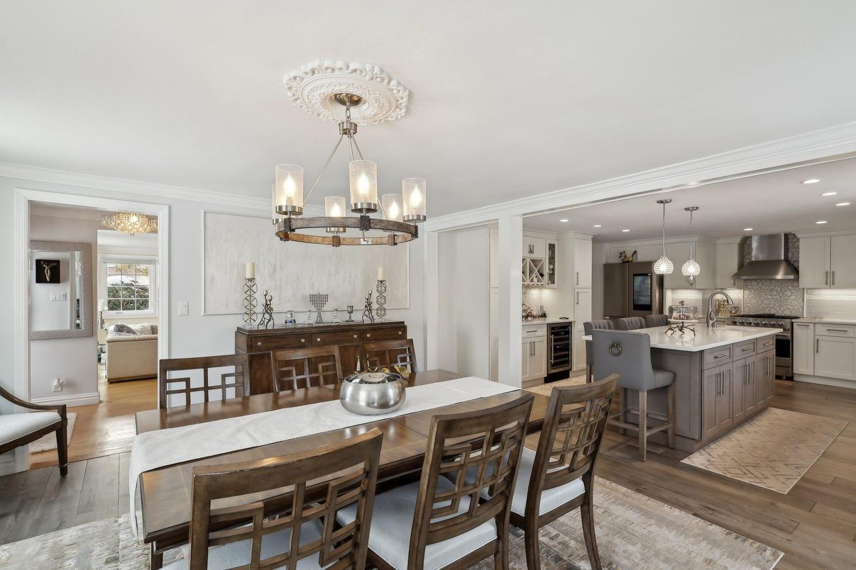 Chandelier, Dining room, Interior, Kitchen, Pendant Lights, Recessed Lighting, Stainless Steel Appliances, Wood Texture Flooring