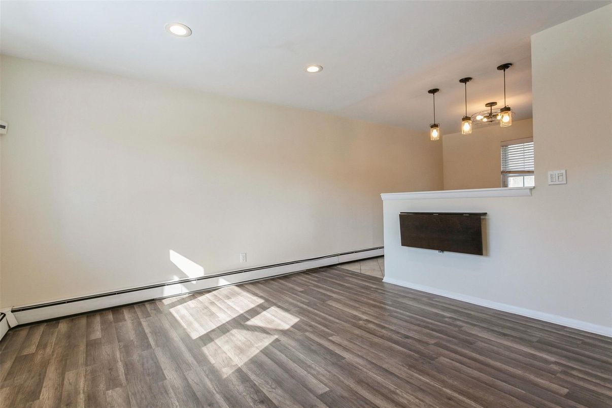 Empty room, Fireplace, Interior, Pendant Lights, Recessed Lighting, Wood Texture Flooring
