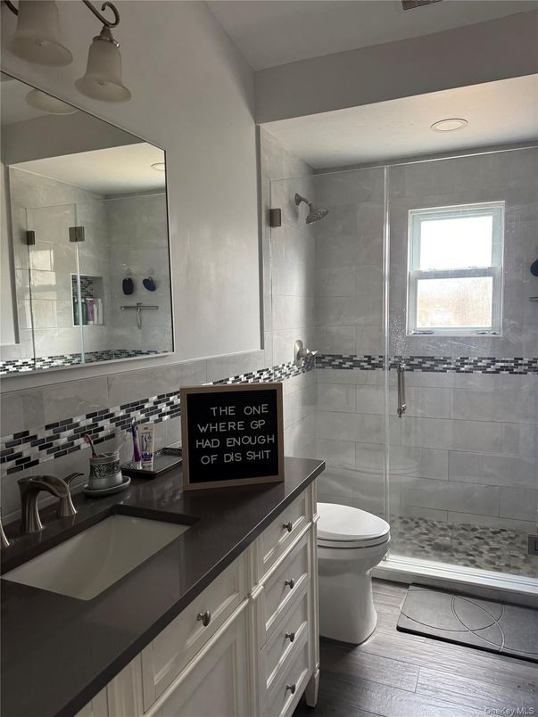 Bathroom, Dual Sink Vanities, Glass Shower, Interior, Wood Texture Flooring