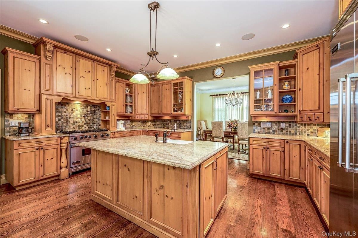 Chandelier, Dining room, Interior, Kitchen, Pendant Lights, Recessed Lighting, Stainless Steel Appliances, Wood Texture Flooring