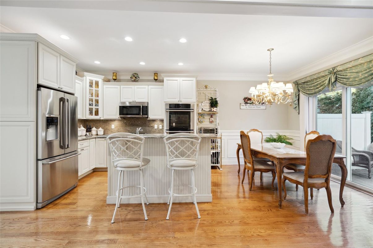 Chandelier, Dining room, Interior, Kitchen, Recessed Lighting, Stainless Steel Appliances, Wood Texture Flooring