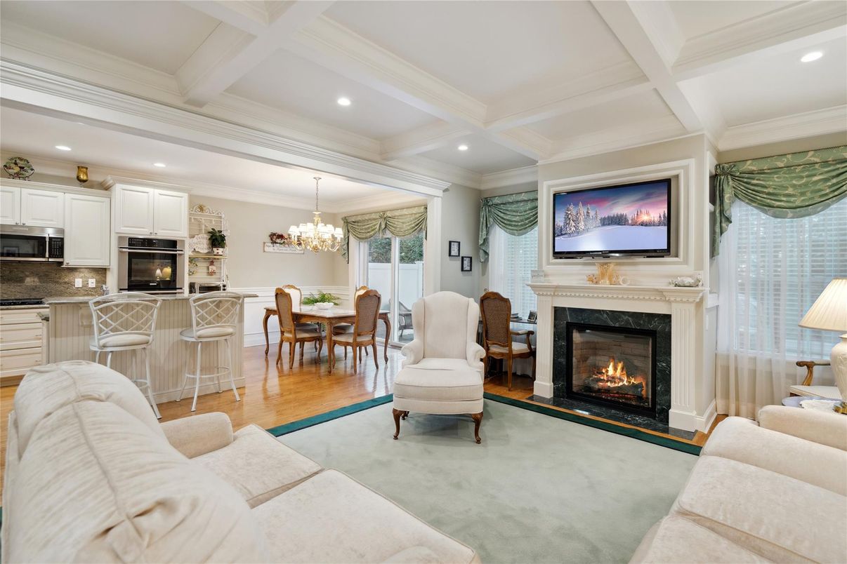 Chandelier, Dining room, Fireplace, Interior, Kitchen, Living room, Recessed Lighting, Wood Texture Flooring