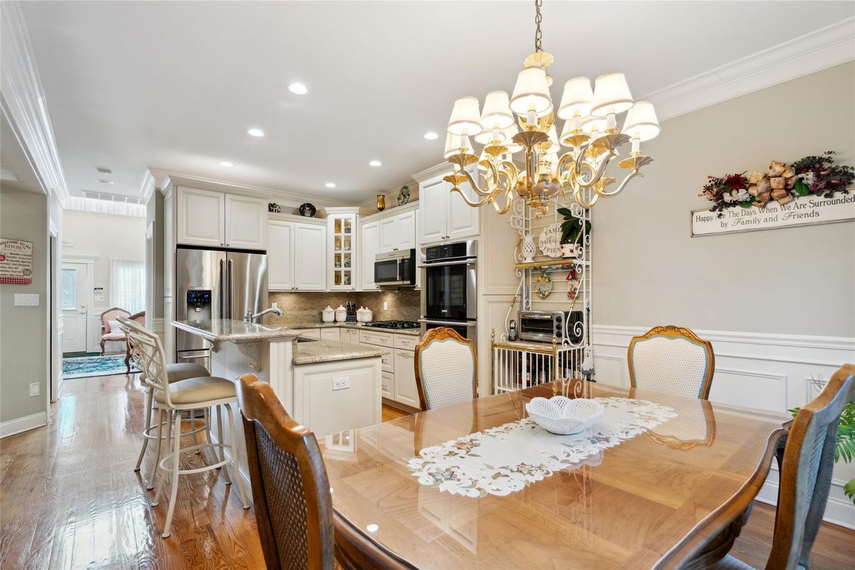 Chandelier, Dining room, Interior, Kitchen, Recessed Lighting, Stainless Steel Appliances, Wood Texture Flooring