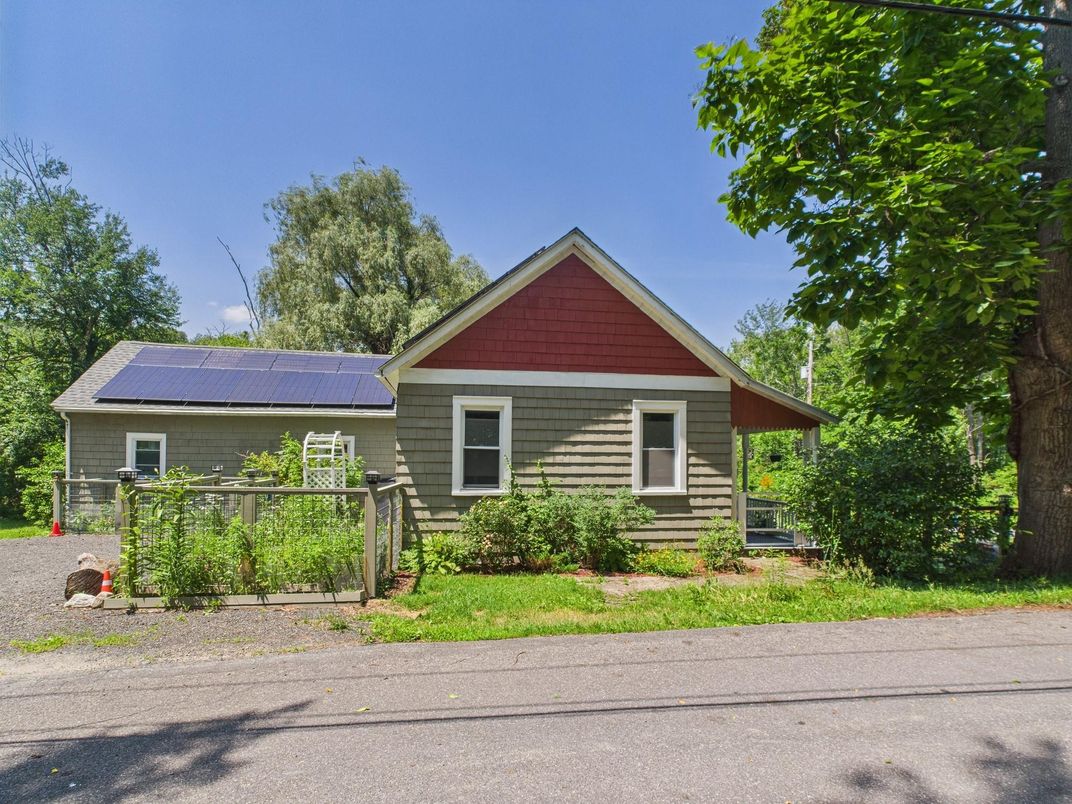 Exterior, Facade, Solar Panels, Log Home