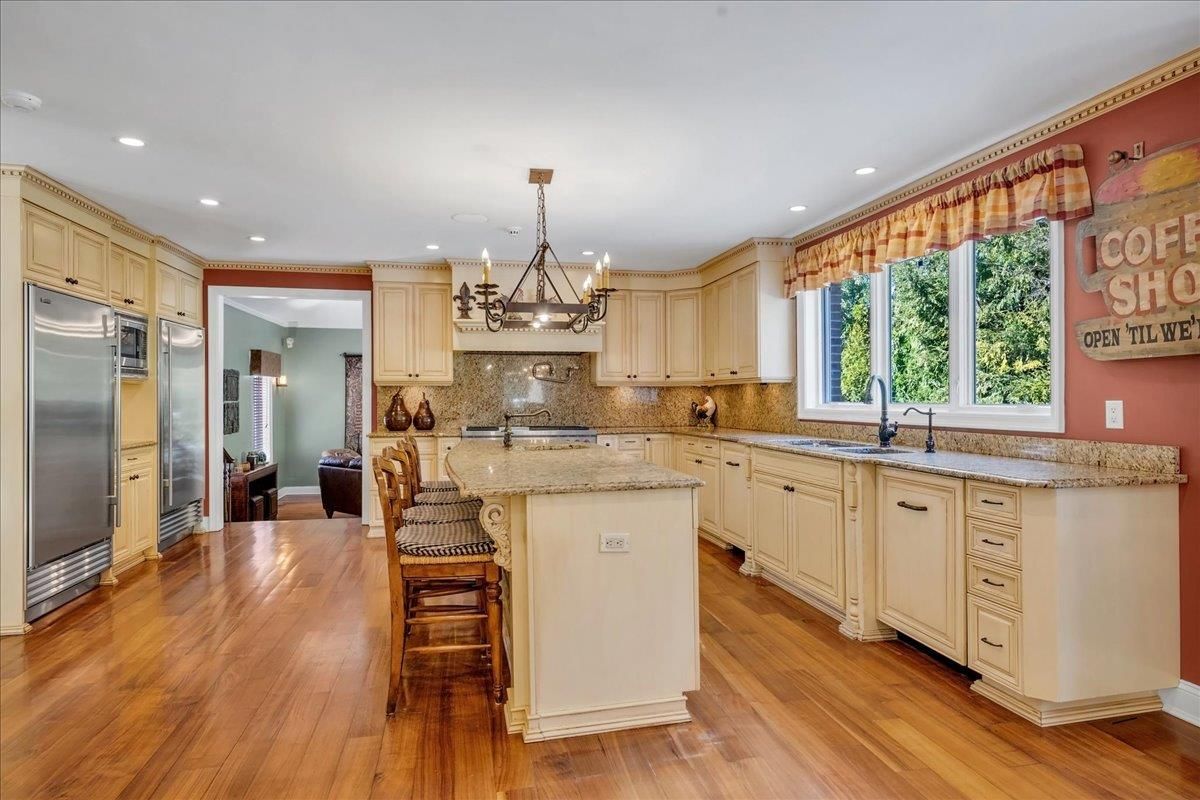 Chandelier, Interior, Kitchen, Pendant Lights, Recessed Lighting, Stainless Steel Appliances, Wood Texture Flooring