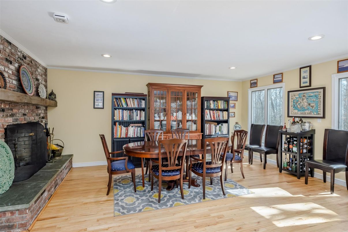 Dining room, Fireplace, Interior, Recessed Lighting, Stone Walls, Wood Texture Flooring